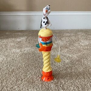 Disney on Ice Olaf spinner. Lights up. Press button and spins and lights up.